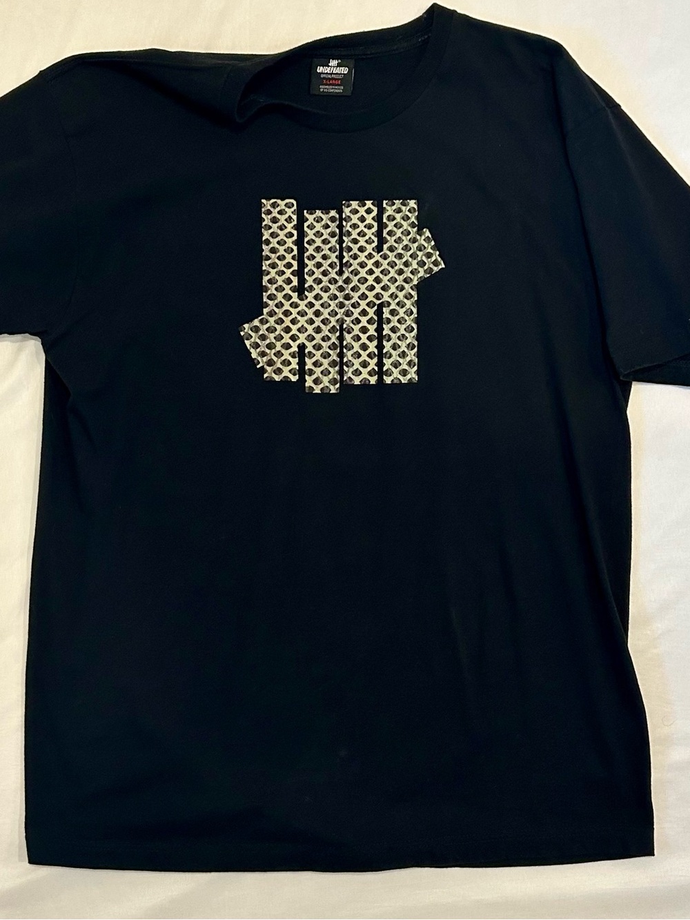 Undefeated Black Tee with White Patterned Logo